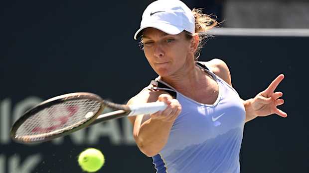 Simona Halep plays a shot against Jil Teichmann.